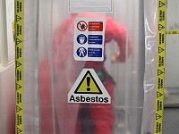 Asbestos enclosure airlock with operative inside